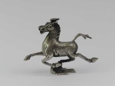 A miniature silver model of the Flying Horse of Gansu