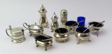 Two three piece silver cruet sets and other cruet items