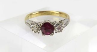 A three stone ruby and diamond ring