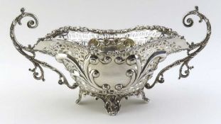 A wide and decorative silver basket