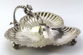 A large silver dish consisting of three stations