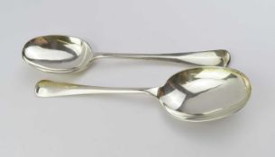 A pair of silver serving spoons