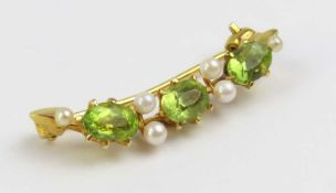 A 20th century peridot and seed pearl brooch