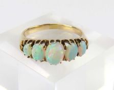 A late 19th or early 20th century opal five stone ring