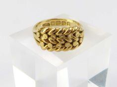 An 18ct gold ball and shot ring
