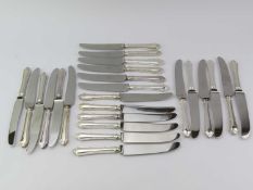 A set of twenty-four Mappin and Webb silver handled starter knives