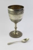 A silver goblet decorated with rings of beads