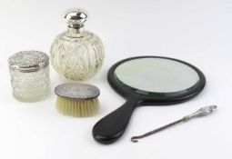 A collection of silver, glass and other beauty items