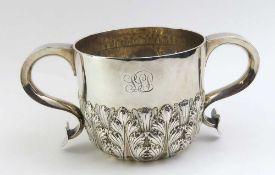 A silver loving cup with wide ogee handles