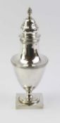 A silver sugar shaker in the form of an urn