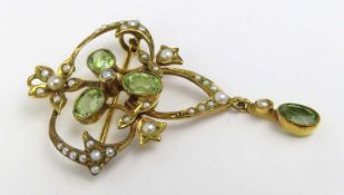 An early 20th century peridot split and seed pearl brooch