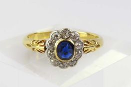 An early to mid-20th century sapphire and diamond cluster ring