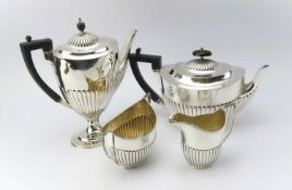 A silver tea set of the same design