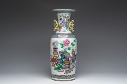 A Chinese famille rose and iron-red vase with a double design of antiquities and Buddhist lions, 19t