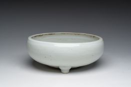 A Chinese monochrome white tripod censer with underglaze design, 19th C.
