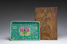 A Chinese famille rose serving dish with floral design, Jiaqing mark, in a Japanese tomobako, 19th/2