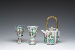 A pair of Chinese famille verte stem cups with floral design and a French Samson famille verte style
