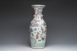 A Chinese famille rose vase with narrative design all around and relief design of peaches, 19th C.