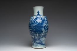 A Chinese blue and white baluster vase with an animated river landscape, 19th C.
