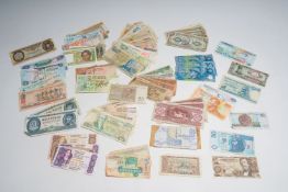 A varied collection of over eighty banknotes of various origins, a.o. Ecuador, Ethiopia, Madagascar,