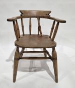 Victorian elm seated captains-style tub chair with turned spindle back (one spindle damaged), saddle