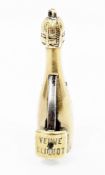 Novelty gilt metal cigar cutter in the form of a Veuve Clicquot champagne bottle, 5cm high (please