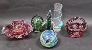 A large Mdina cased paperweight, decorated with green and blue swirls, a Victorian green tinted dump