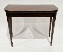 Early 19th century-style mahogany card table, the rectanglar fold-over top with rounded corners,