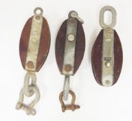 Three Royal Navy ships block pulleys, all marked with a broad arrow and test 2 tonnes, two with