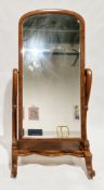 Large Victorian walnut framed cheval mirror, the domed top frame holding a bevelled plate, on carved