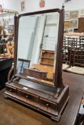 George III mahogany swing dressing table mirror, the bevel edged plate held on a frame with brass