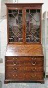 George III mahogany bureau bookcase, the upper section with dentil moulded cornice over two