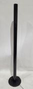 An Italian Artemide Megaron black metal floor lamp, designed by Gianfranco Frattini, 182cm high