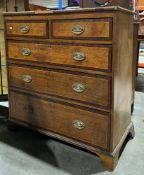 George III oak chest of drawers with mahogany crossbanding and satinwood inlay, comprising two short