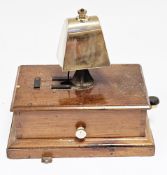 Early 20th century railway signal box block bell with brass cow type bell on a mahogany base, 26cm