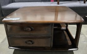 Ercol dark stained elm Pandora coffee table/bookcase, model no. 735, on castors, 40cm high x 80cm