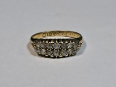 Victorian 18ct yellow gold and diamond ring comprising two rows of seven old cut round diamonds,