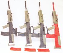 Four L85 / SA80 style airsoft rifles, four in black and green, a further in red and green with