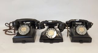 Three early 20th century black bakelite telephones, all with drawers, one stamped GPO 1/232F (please