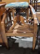 Modern hardwood tub chair with metal mesh back panel, solid seat, on square tapering legs with spade