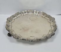 Large 20th century silver salver by Viners & Co, with shell decorated border, raised on three
