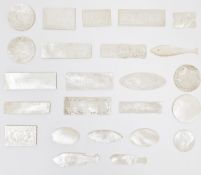 Collection of 25 Chinese mother-of-pearl gaming counters, three in the form of fish and the others