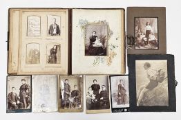 Victorian brown leather CDV photograph album, partly filled with black and white family photographic