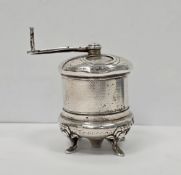 Unusual Georgian white metal pepper grinder of cylindrical form, raised on four cabriole legs,