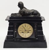 Victorian Egyptian Revival black slate mantle clock, the case of architectural form and surmounted