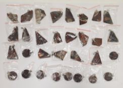 Collection of over 100 polished stones mounted on as pendants including crazy lace agate, blue and