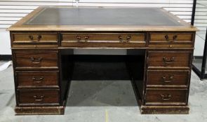 Mahogany twin pedestal desk in the George lll manner, the rectangular top with green leather and