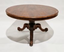 Victorian rosewood centre table, the circular tilt-top on a turned baluster support with three