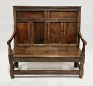 George III oak and elm settle, the high panelled back over a solid elm seat with arms, on turned and
