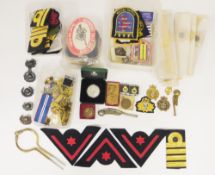 Collection of Royal Navy related items including two bosun's whistles, jacket buttons, shoulder